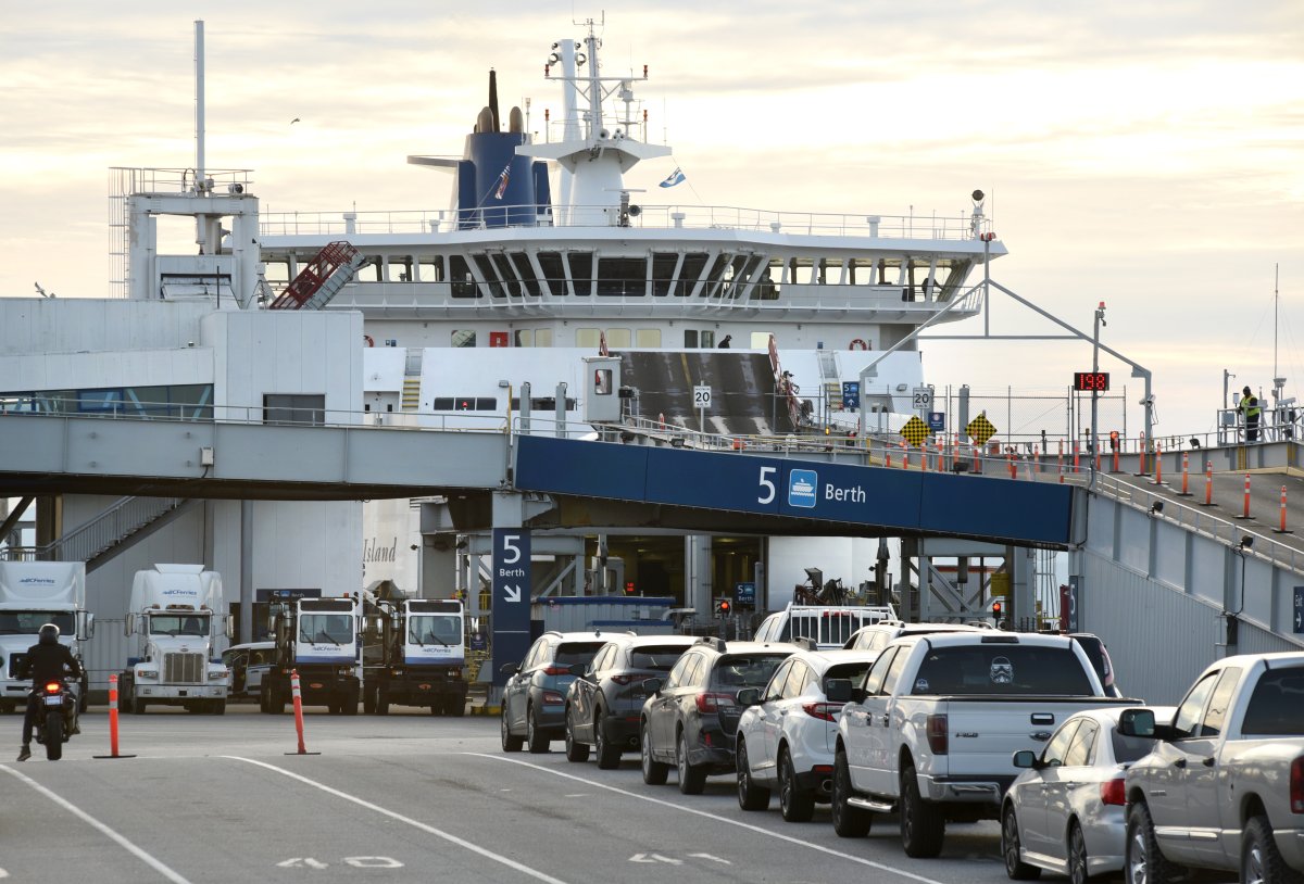 A view of traffic, including cars, trucks and motorcycles, waiting to board a ferry at the BC Ferries terminal at Tsawwassen, British Columbia on October 25, 2020.  