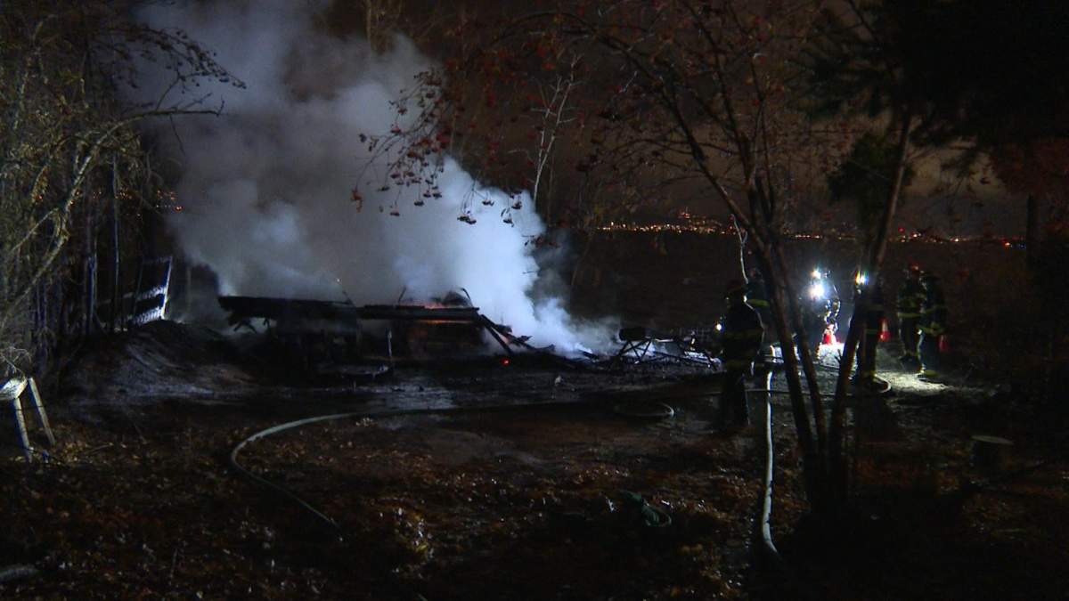 Two vehicles and a building were completely destroyed in a fire on Lakeshore Drive Tuesday afternoon. 