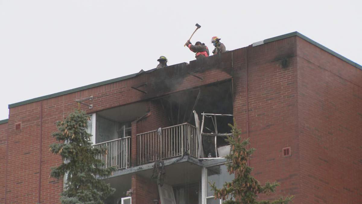 Toronto firefighters on the roof of an apartment building on Cavell Avenue.