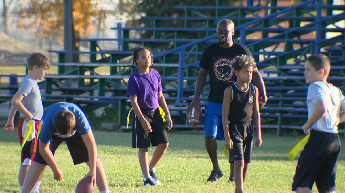 Oneil White running a drill at practice for the Thundercats flag football team.