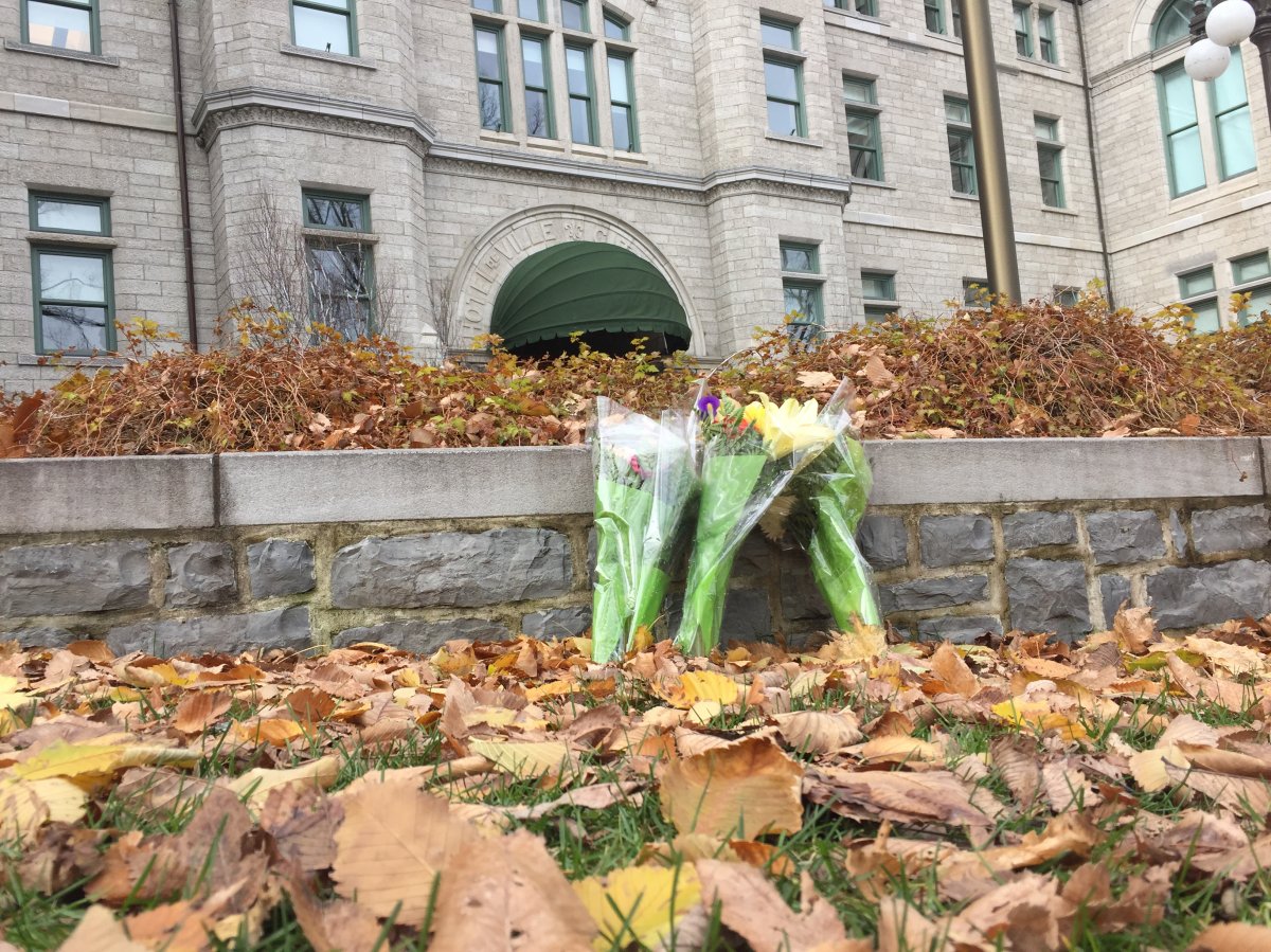 Flowers are laid in Quebec City after a deadly sword attack on Halloween left two people dead and five others injured.
