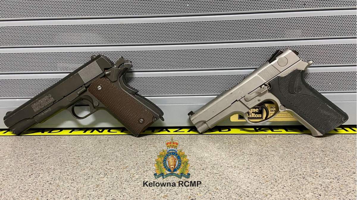 Kelowna RCMP released this picture to show how difficult it can be to tell the difference between imitation guns and the real thing.  The black and brown pistol on the left is a bb gun. The grey and black pistol on the right is a police service weapon. 