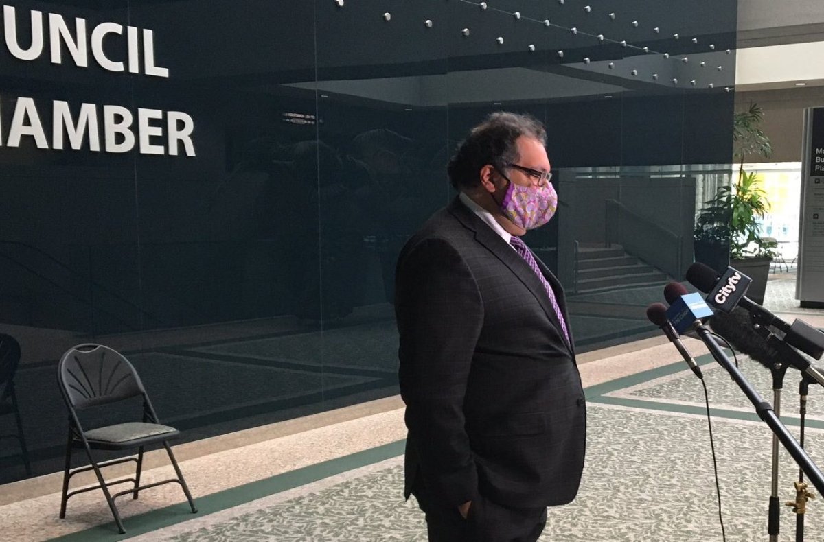 Calgary Mayor Naheed Nenshi addresses media on Nov. 24, 2020, in front of council chambers.