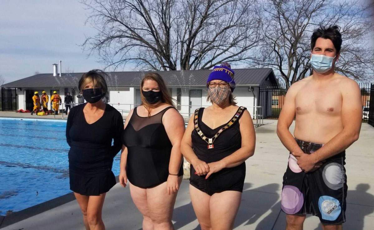 Middlesex County Warden Cathy Burghardt-Jesson, Deputy Mayor Kelly Elliott, Thames Centre Mayor Alison Warwick, and Coun. Tom Heeman prepare to jump into the newly renovated Dorchester community pool to raise money for the Thames Centre Food Bank on Thursday, Nov. 19, 2020. 