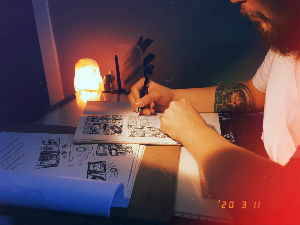 Kyle Charles drawing in his studio