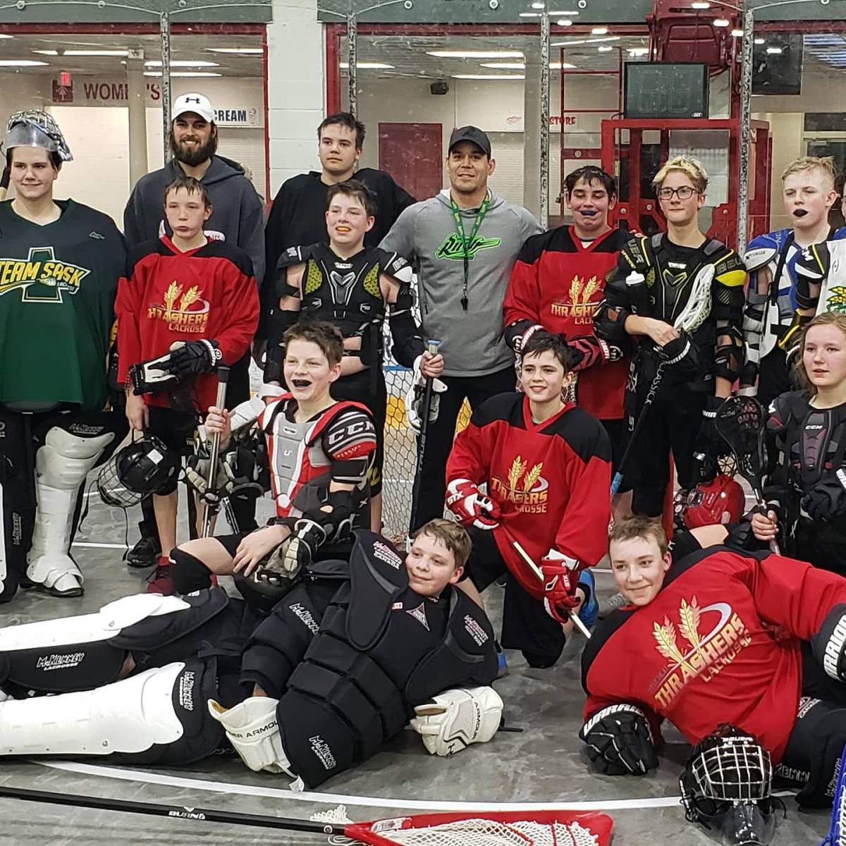 Saskatchewan Rush forward Jeff Shattler (top middle) at one of his camps with young lacrosse athletes.