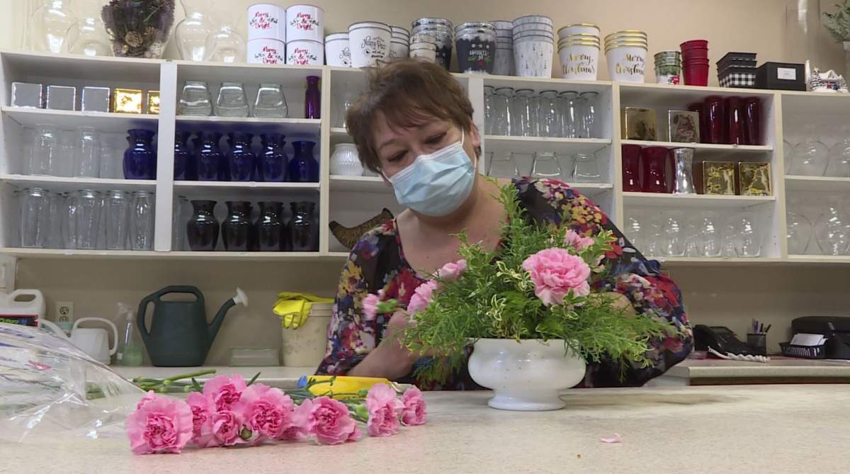 Louise Sitar working on bouquet at Macyk’s Florist on Sunday.