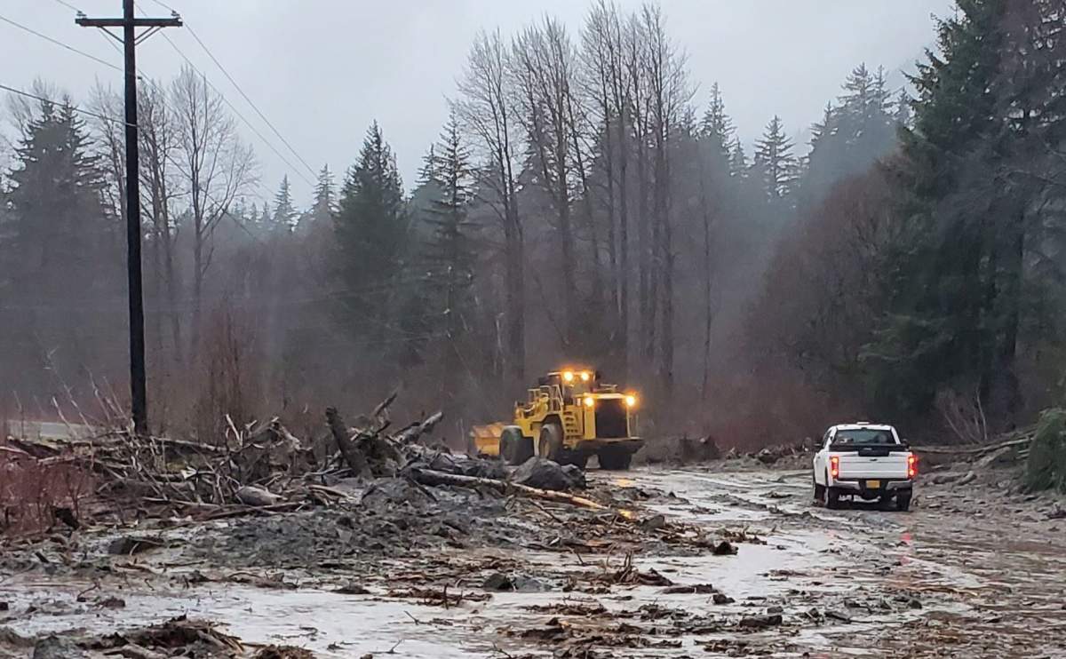 Crews with the Alaska Department of Transportation & Public Facilities work to clear debris from a mudslide in Haines, Alaska on Dec. 2, 2020.