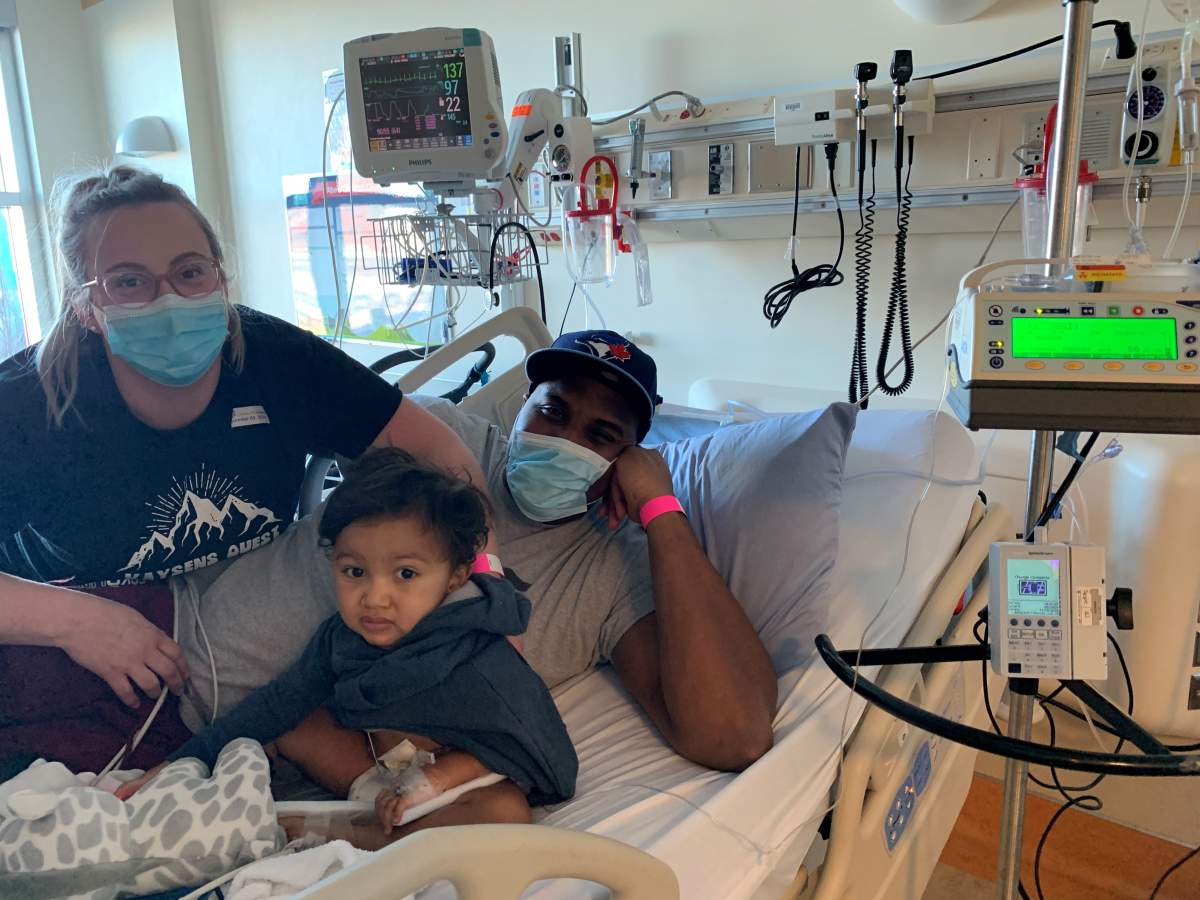 Kaysen Martin, who has spinal muscular atrophy Type 1 (SMA 1), with his mom and dad in Calgary Children’s Hospital Dec. 3, 2020.
