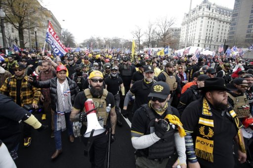 Supporters of President Donald Trump who are wearing attire associated with the Proud Boys attend a rally at Freedom Plaza, Saturday, Dec. 12, 2020, in Washington.