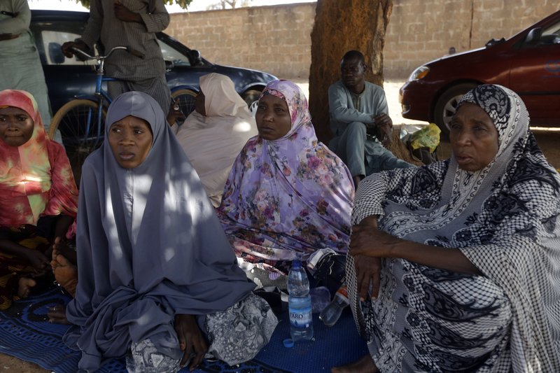 Parents of the missing Government Science secondary school students wait for news on their children in Kankara , Nigeria, Tuesday, Dec. 15, 2020. Rebels from the Boko Haram extremist group claimed responsibility Tuesday for abducting hundreds of boys from a school in Nigeria's northern Katsina State last week in one of the largest such attacks in years, raising fears of a growing wave of violence in the region. 
