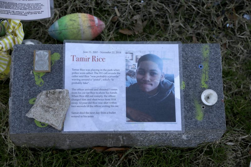 FILE - In this Dec. 13, 2020, file photo a memorial for Tamir Rice is seen at the base of the Gen. Robert E. Lee statue is seen Sunday Dec. 13, 2020 in Richmond, Va. The Justice Department announced Tuesday, Dec. 29, 2020, that it would not bring federal criminal charges against two Cleveland police officers in the 2014 killing of 12-year-old Tamir Rice, saying video of the shooting was of too poor a quality for prosecutors to conclusively establish what had happened. 