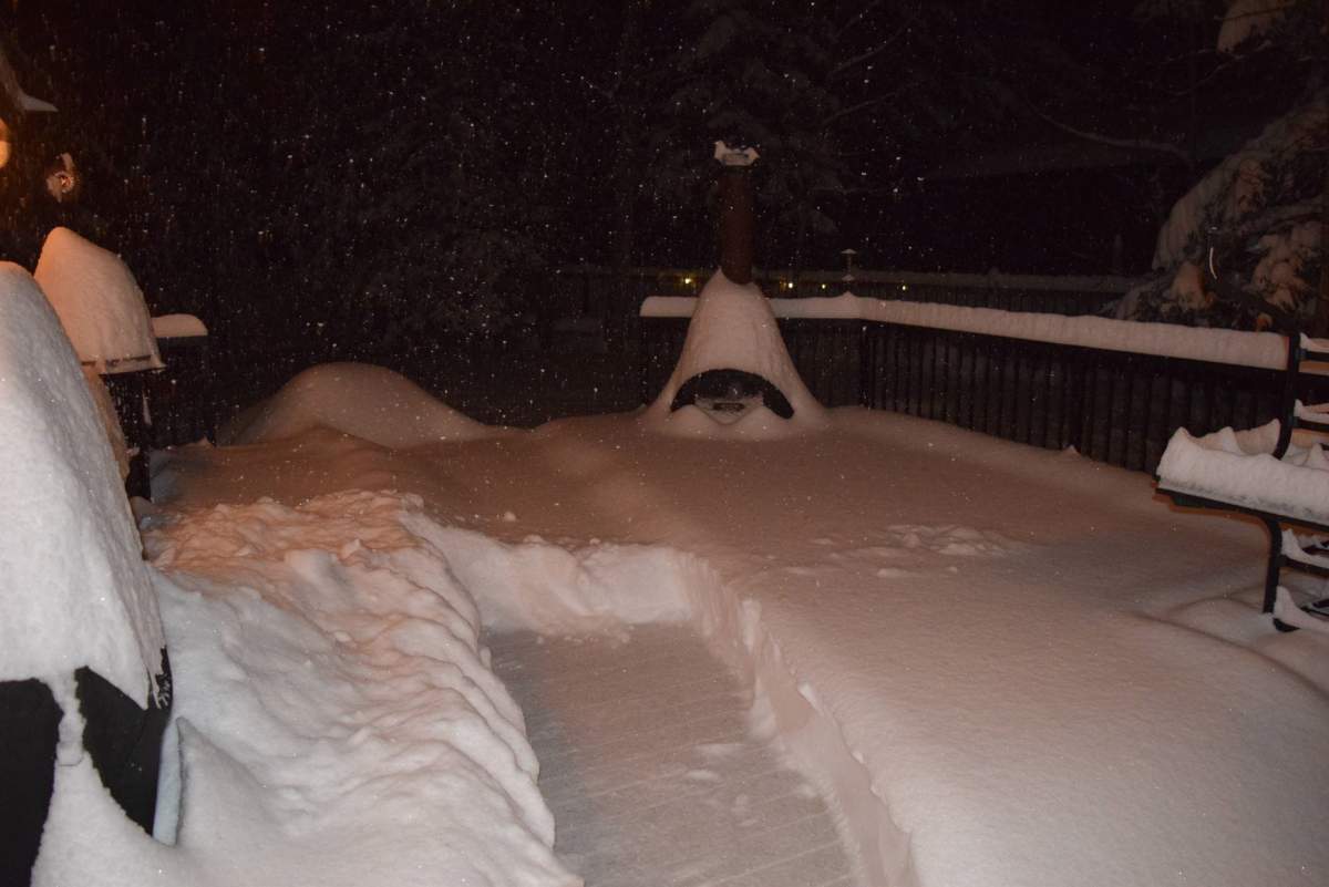 A snow-covered back deck is seen in Bragg Creek on Tuesday, Dec. 22.
