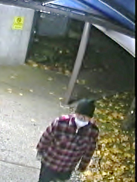 Burnaby RCMP is hoping to speak to the person in this photo, taken on the night of the fire at the hospital.