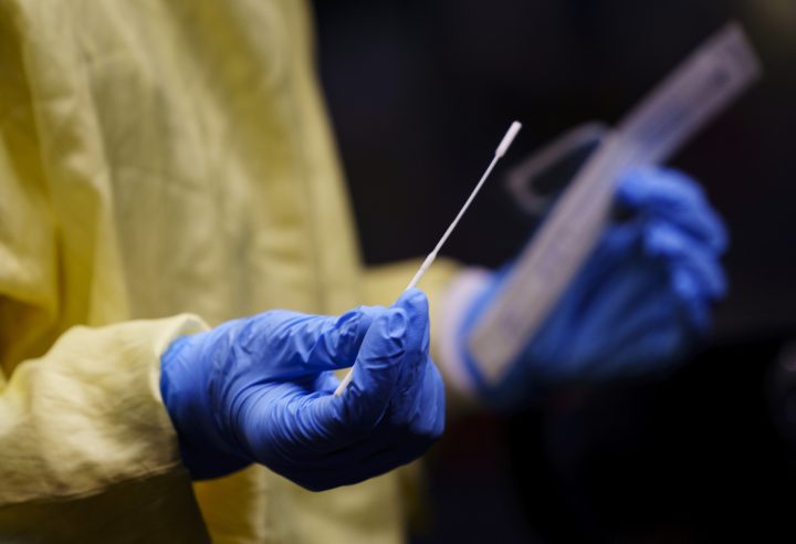A nurse gets a swab ready to perform a test on a patient at a drive-in COVID-19 clinic in Montreal, on Wednesday, October 21, 2020. 