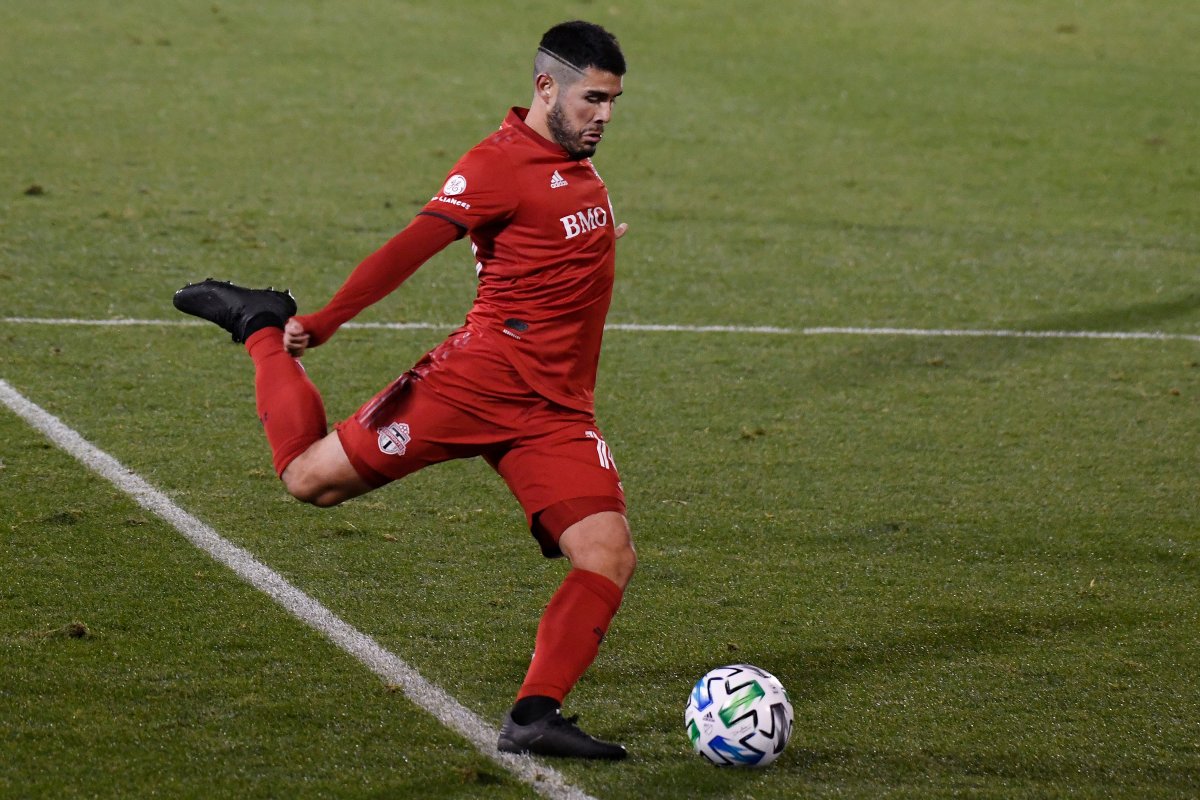 Toronto FC's Alejandro Pozuelo takes a shot on goal during overtime of the team's MLS soccer playoff match against Nashville SC, Tuesday, Nov. 24, 2020, in East Hartford, Conn.
