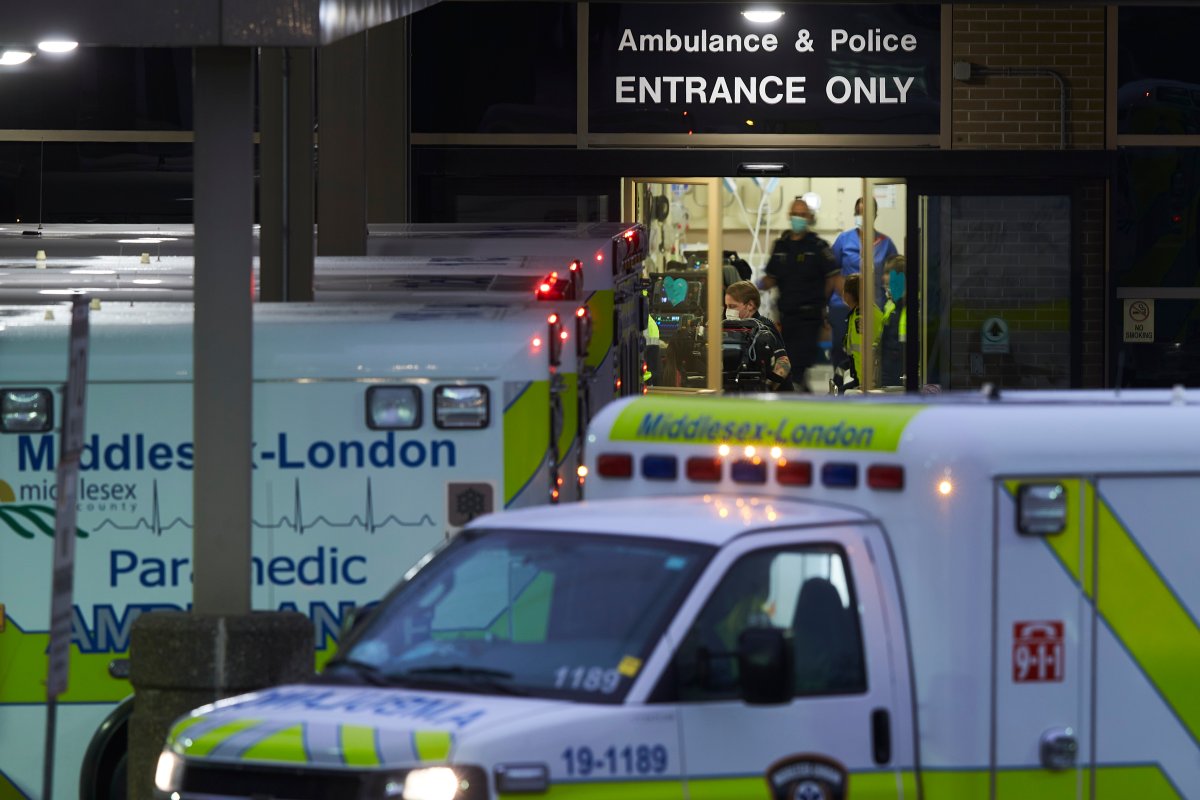 Ambulances sit in front of the emergency department at Victoria Hospital on Nov. 25, 2020. The hospital has had to open 24 beds to maintain capacity after admissions were reduced at University Hospital in the wake of a large COVID-19 outbreak there.