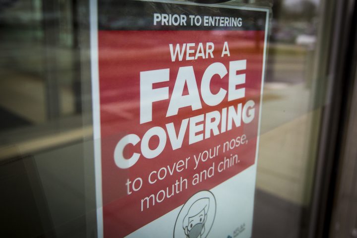 A sign advising to wear a face covering in Kingston, Ontario on Thursday, December 10, 2020, as the COVID-19 pandemic continues across Canada and around the world.