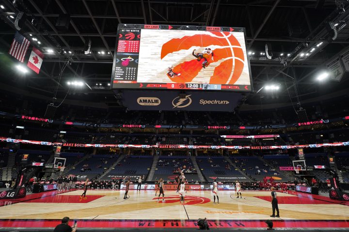The Toronto Raptors and the Miami Heat tip off to start during the first half of an NBA preseason basketball game Friday, Dec. 18, 2020, in Tampa, Fla. The Raptors are playing their home games in Tampa as a result of Canada's strict travel regulations stemming from the coronavirus pandemic.