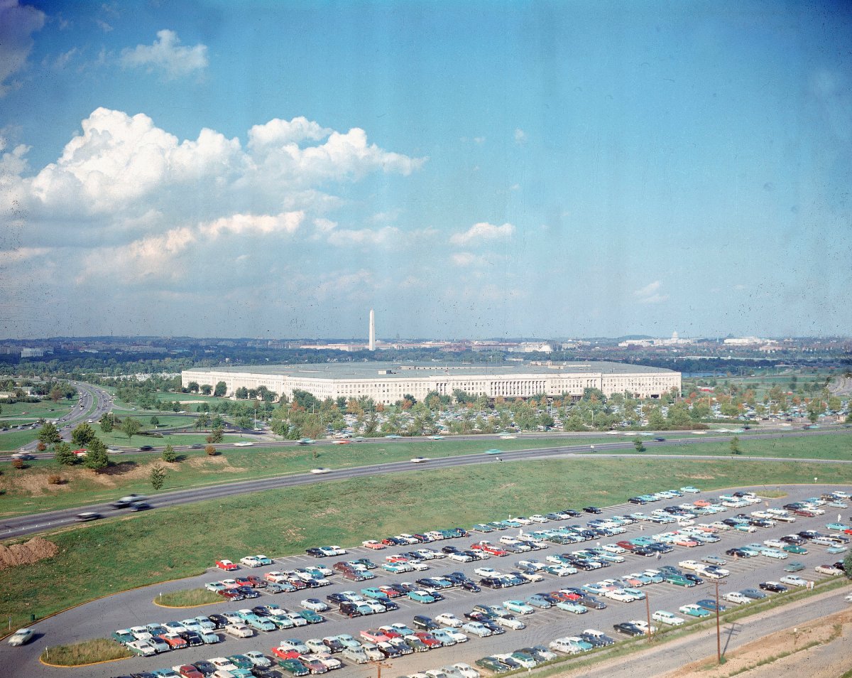 File-This undated file photo shows the Pentagon, headquarters of the U.S. Department of Defense, with the Washington Monument in background and a large parking lot in foreground, in Arlington, Va.