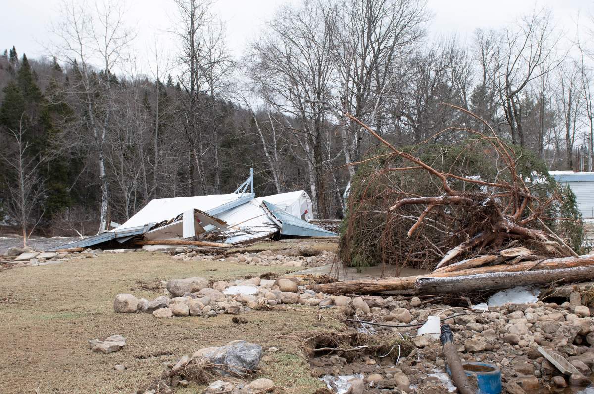 A ruined clubhouse is seen on the campground, in Sainte-Brigitte-de-Laval, Que., Saturday, Dec. 26, 2020. A flash flood forced the evacuation of residents on Christmas day, Dec. 25, as the waters of the Montmorency river came up because of heavy rains. 