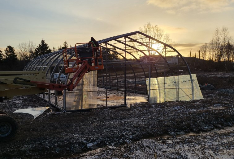The Potlotek First Nation in Cape Breton, along with other Indigenous communities in Atlantic Canada, is in the midst of a new gardening project to address food insecurity with a geothermally-heated greenhouse, shown under construction in a handout photo, to allow for year-round food production. 