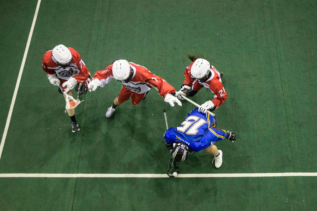 File photo - British Columbia's Mattea Shima (15) holds off Ontario defenders during women's lacrosse action at the North American Indigenous Games in Hagerville, Ontario, on Monday, July 17, 2017. 