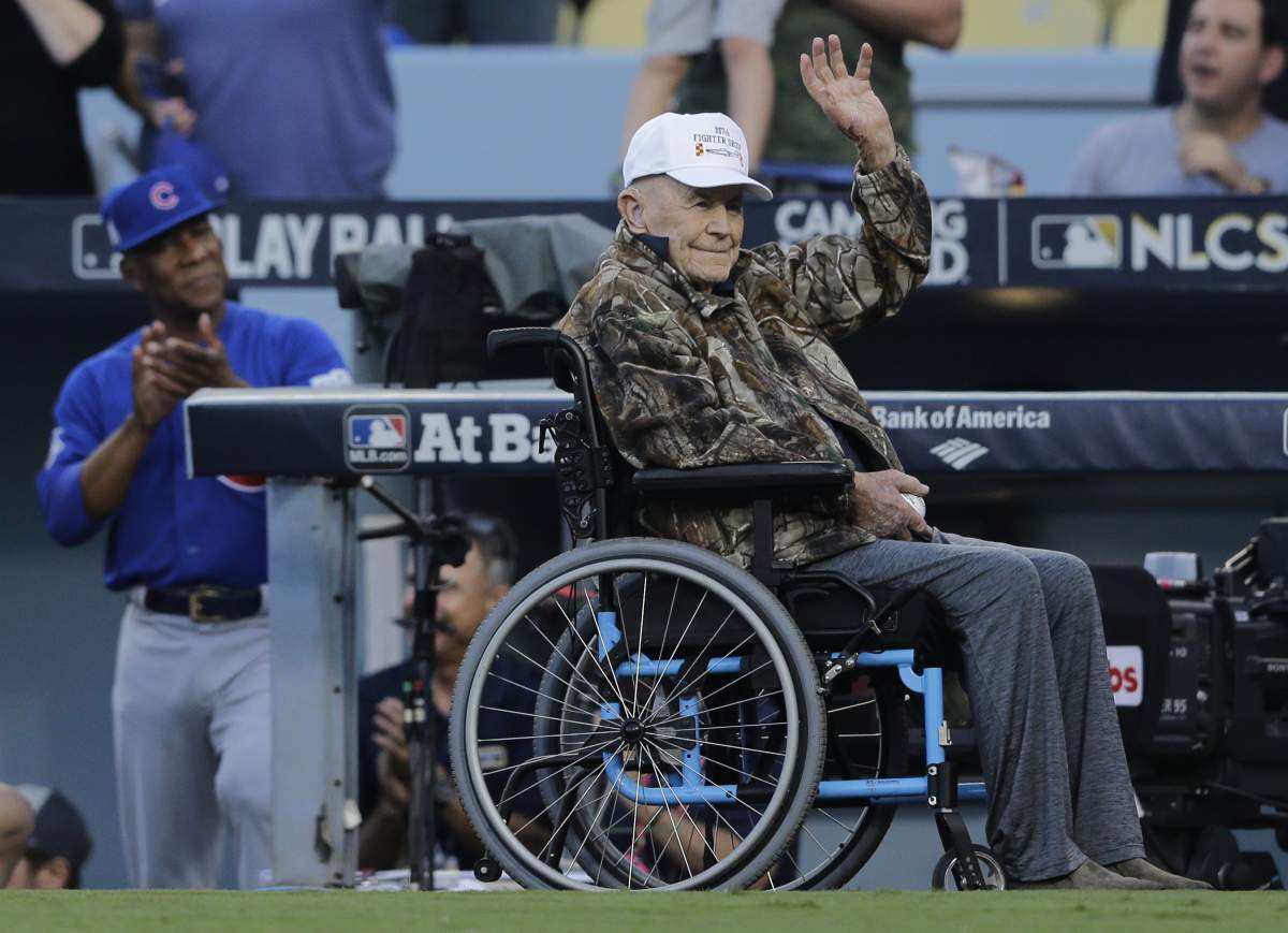 epa06266445 US former test pilot and record setting aviator Chuck Yeager (R) waves to fans prior to the start of the the Major League Baseball (MLB) National League Championship Series (NLCS) game one between the Los Angeles Dodgers and Chicago Cubs at Dodger Stadium in Los Angeles, California, USA, 14 October 2017. EPA/PAUL BUCK
