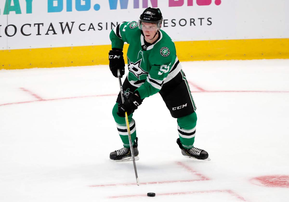 Dallas Stars defenseman Thomas Harley (55) handles the puck in the third period of a preseason NHL hockey game against the St. Louis Blues in Dallas, Monday, Sept. 16, 2019. 