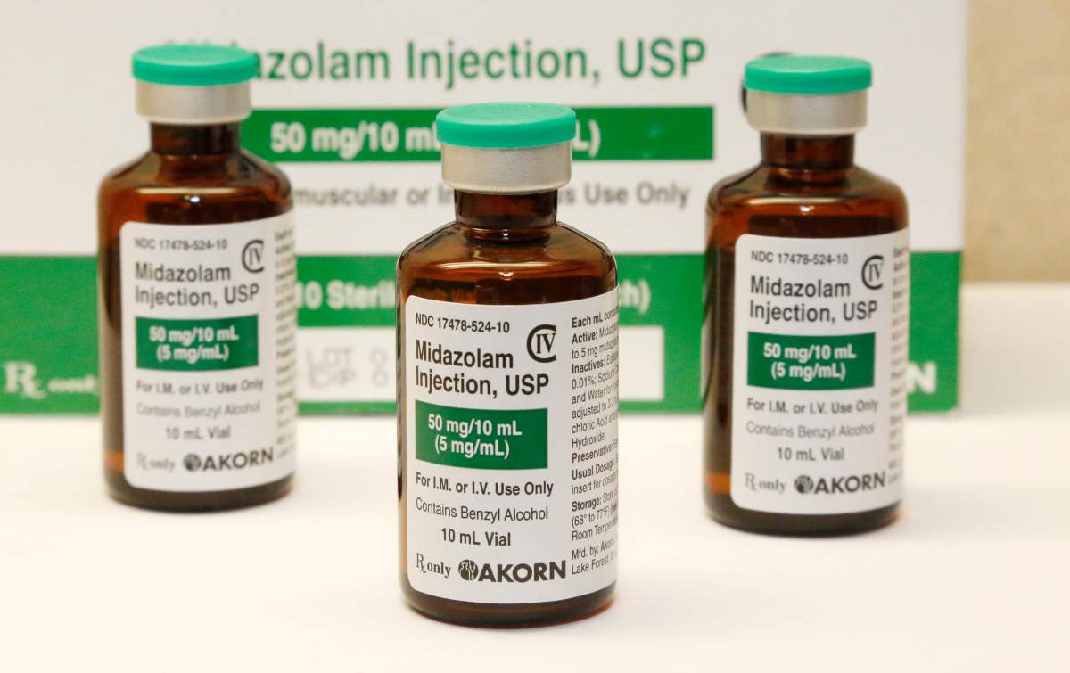FILE - This July 25, 2014 file photo shows bottles of the sedative midazolam at a hospital pharmacy in Oklahoma City.