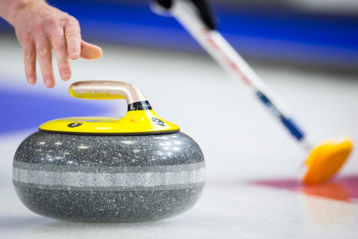 A curler releases a rock during play at the Brier in Brandon, Man., Tuesday, March, 5, 2019. 