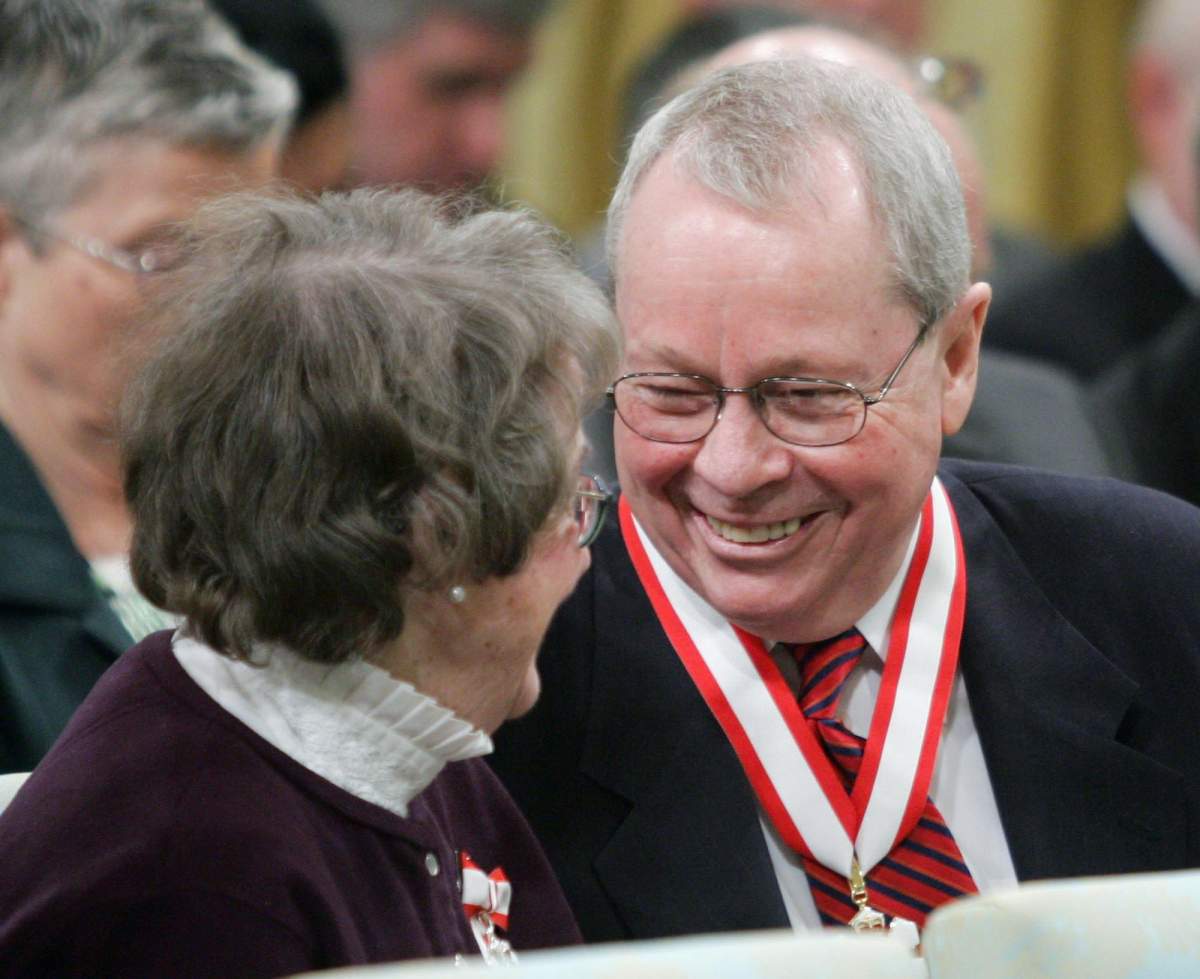 Former Toronto mayor David Crombie (right) laughs with Budge Wilson of Halifax after receiving the Order of Canada during a ceremony at Rideau Hall in Ottawa Friday, March 11, 2005.