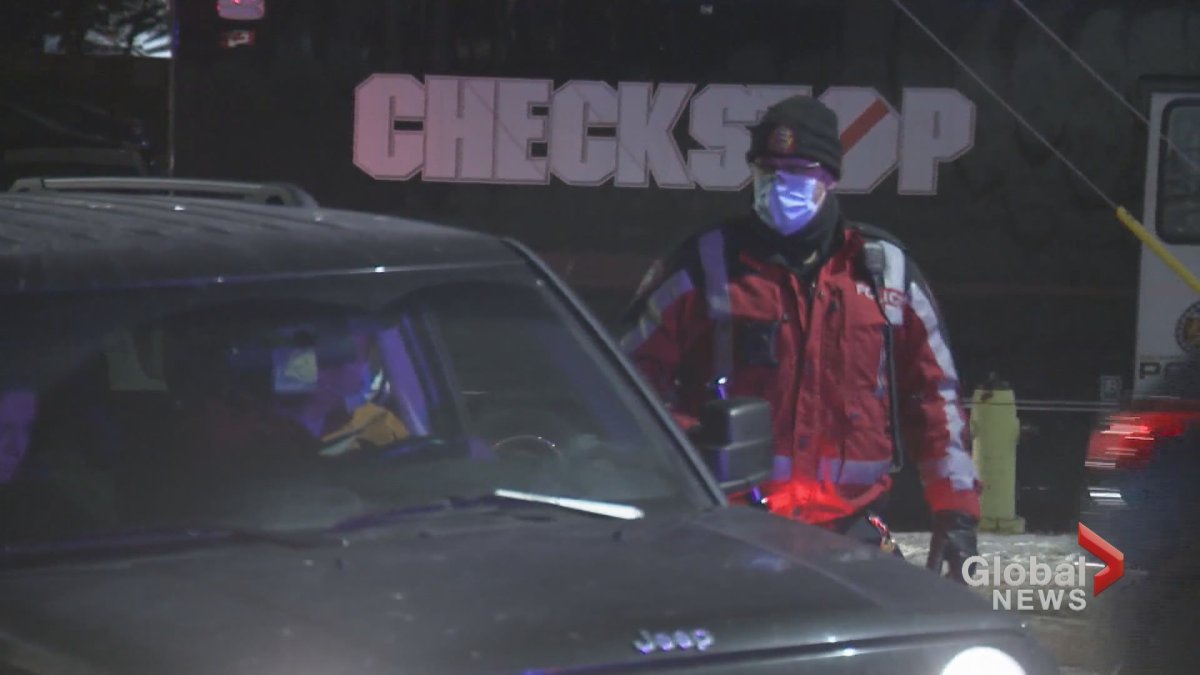 A Calgary police officer wears a face mask during a checkstop conducted during the COVID-19 pandemic. 