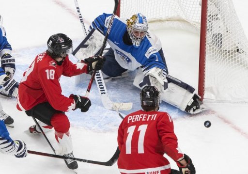 Canada’s Peyton Krebs (18) is stopped by Finland goalie Kari Piiroinen (1) as Cole Perfetti (11) looks for the rebound during first period IIHF World Junior Hockey Championship action in Edmonton, Thursday, Dec. 31, 2020.