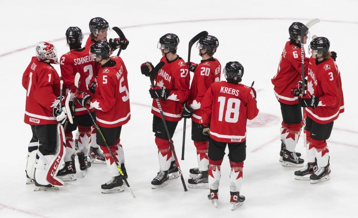 Canada celebrates the team’s win after IIHF World Junior Hockey Championship action against Finland, in Edmonton, Thursday, Dec. 31, 2020.