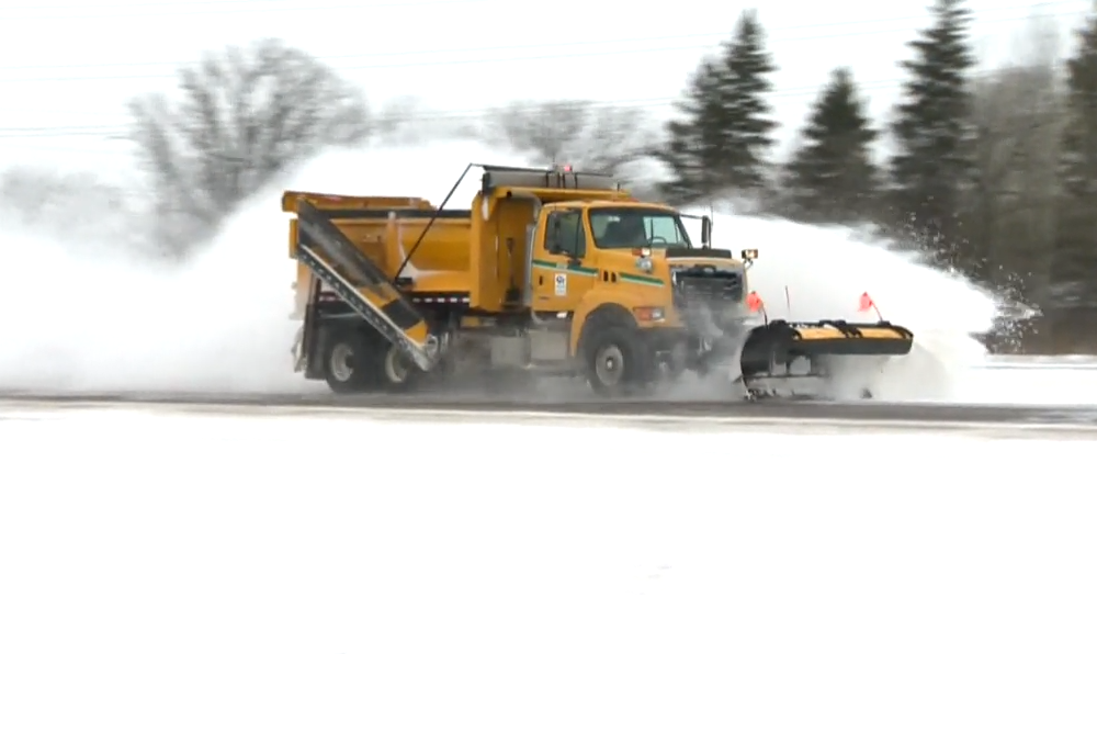 Snowplow on Manitoba highway.