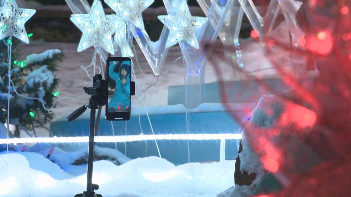 Cole Borromeo dances at the Christmas at Bob’s display