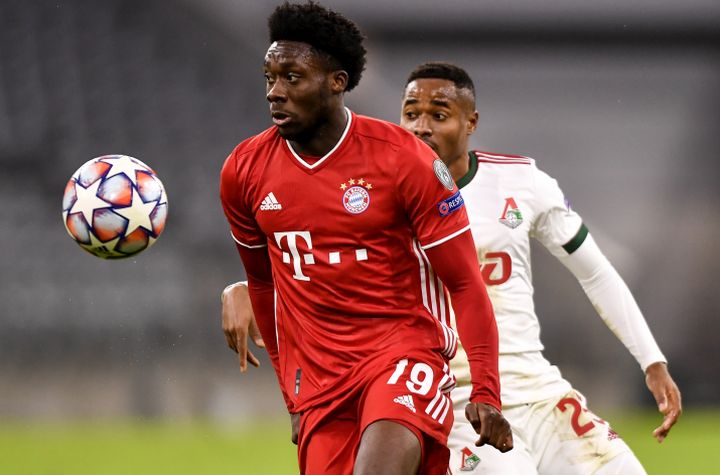 Alphonso Davies (L) of Bayern Munich in action against Francois Kamano (R) of Lokomotiv Moscow during the UEFA Champions League group A soccer match between Bayern Munich and Lokomotiv Moscow in Munich, Germany, 09 December 2020.  