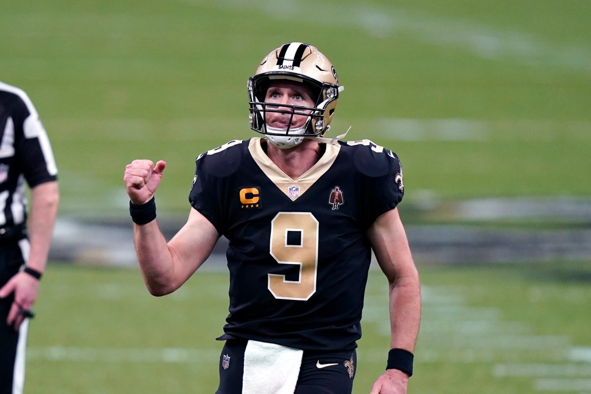 New Orleans Saints quarterback Drew Brees (9) reacts after throwing touchdown pass in the second half of an NFL football game against the Kansas City Chiefs in New Orleans, Sunday, Dec. 20, 2020.