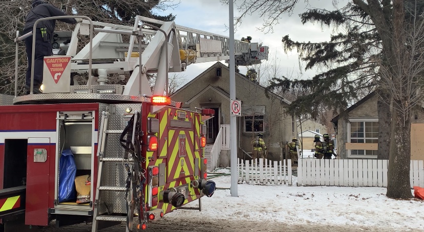 Edmonton firefighters work to extinguish a house fire on 119 Avenue and 79 Street, Sunday, Dec. 20, 2020. 