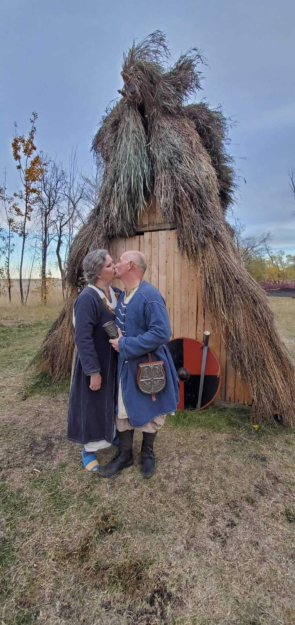 Pedro Bedard and his wife Wendy Speary in front of their hut.