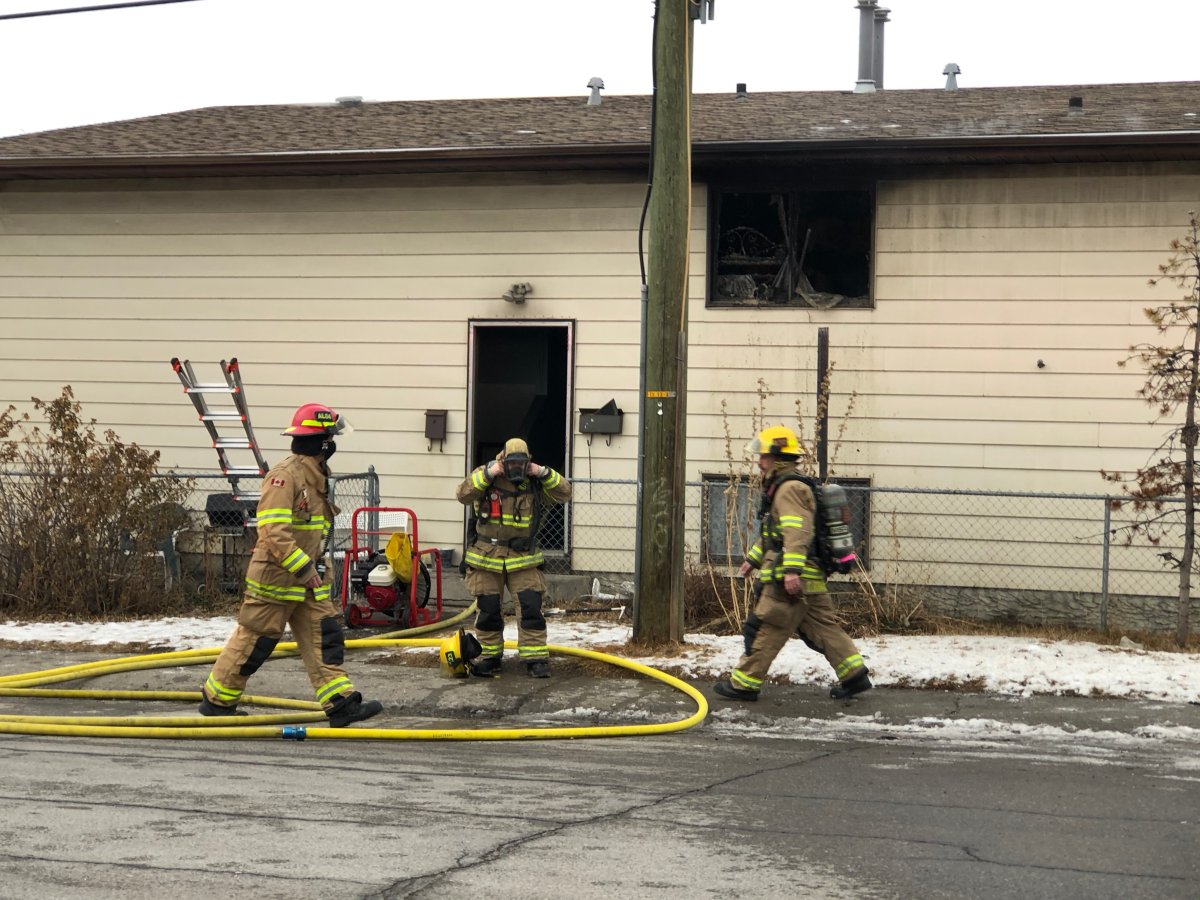 Calgary firefighters at the scene of a house fire in Forest Lawn on Friday, Dec. 18. 