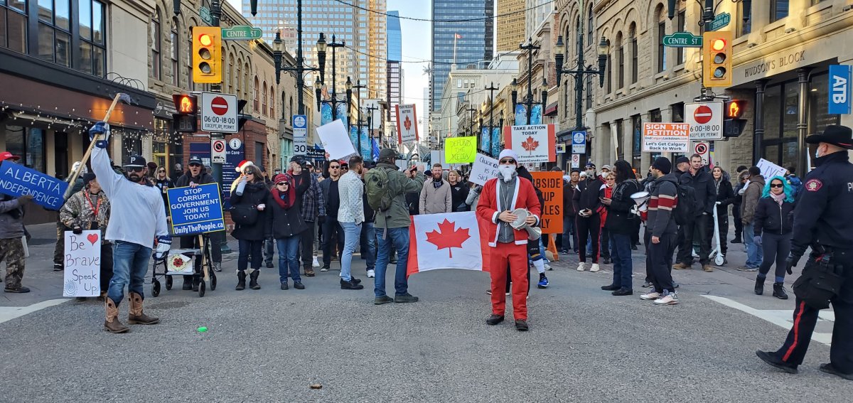 Five people were arrested at an anti-mask rally on Saturday and charged with obstructing a peace officer, assault a police officer and resisting arrest, according to Calgary Police. 