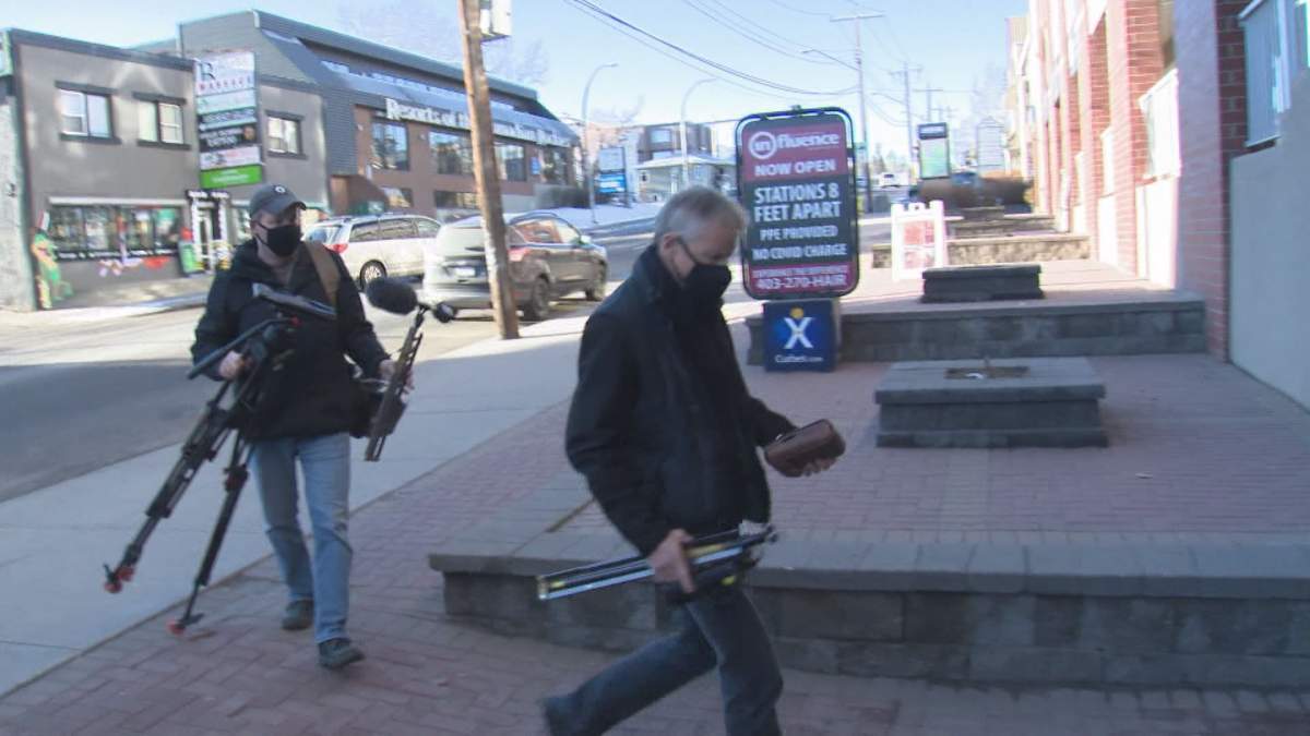 A Global News television crew arrives at an interview location, following various COVID-19 public health measures.