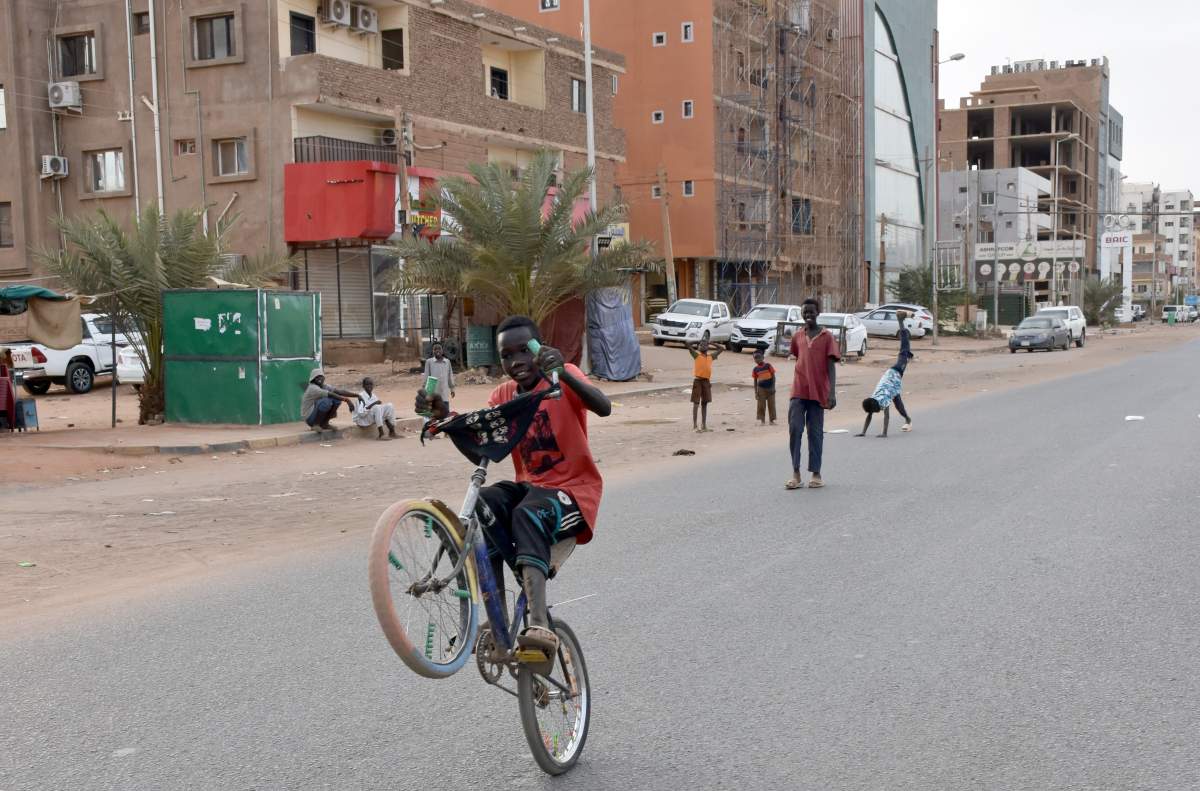 Children, who don’t follow the ban, are seen cycling in an empty street after a three-week lockdown began as part of coronavirus precautions, on April 18, 2020, in Khartoum, Sudan. (Photo by Omer Erdem/Anadolu Agency via Getty Images)