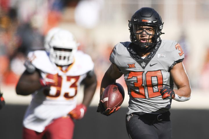 Chuba Hubbard (30) scores a touchdown during the first half of an NCAA college football game against Iowa State Saturday, Oct. 24, 2020, in Stillwater, Okla. 