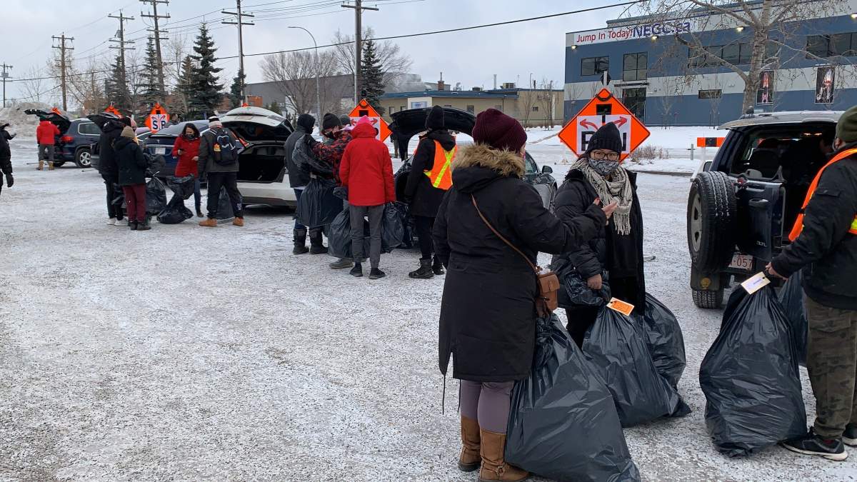 Volunteers helping get gift packages ready to be delivered as part of the 630 CHED Santas Anonymous campaign on Sunday, Dec. 13, 2020.
