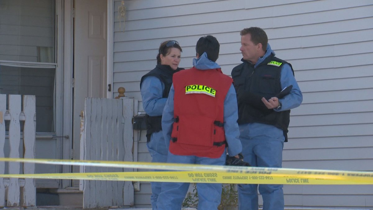 Sgt. Jodi Arns examines a Calgary crime scene in November 2011.