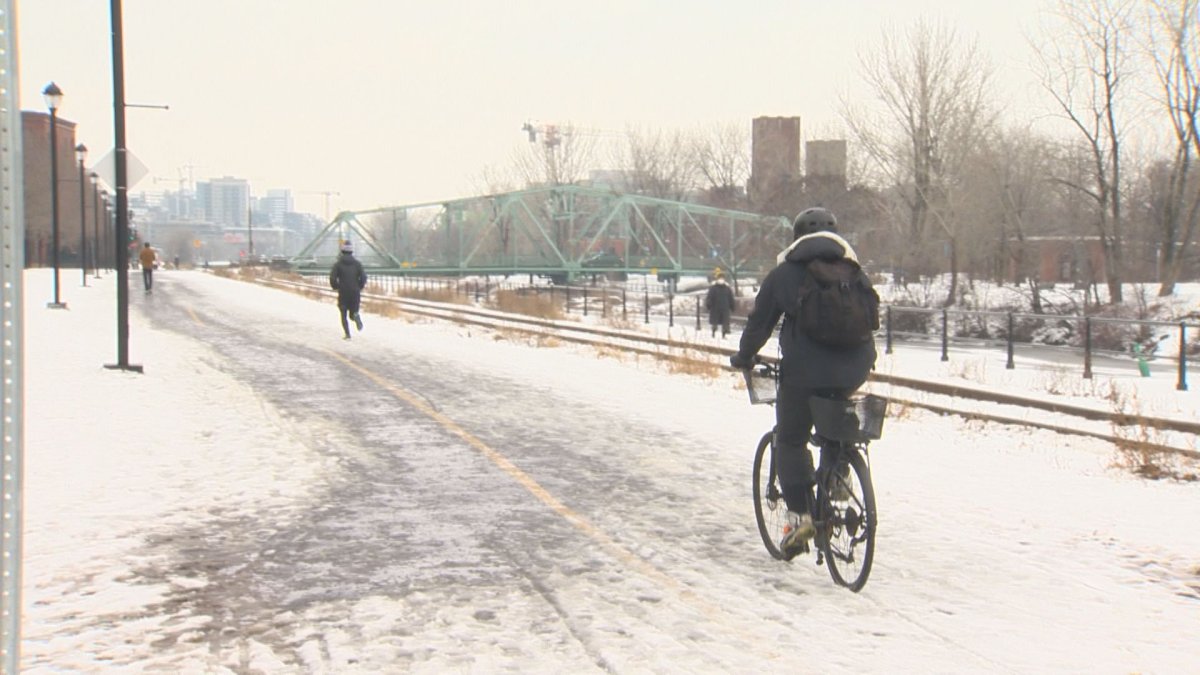 A cyclist is seen using the multipurpose path by the Lachine Canal on Friday, Dec. 22, 2020. 