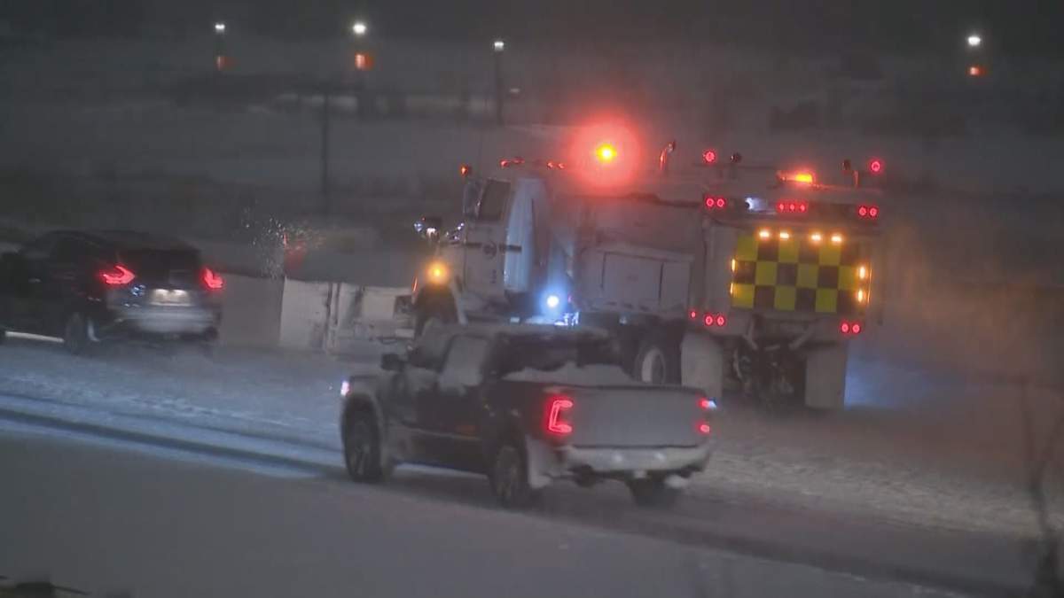 A snowplow is seen clearing snow on a Calgary roadway on Dec. 22, after upwards of 20 centimetres fell overnight.